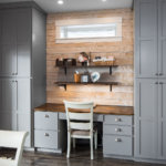 Gray shaker cabinets and wood shiplap in a custom built home office space.