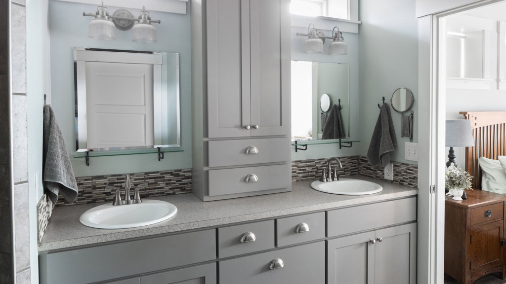 Custom gray shaker cabinets with brushed nickel hardware and mosaic tile in master bathroom.